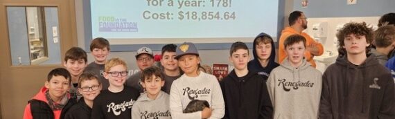 Renegade players and family volunteer at Feed My Starving Children